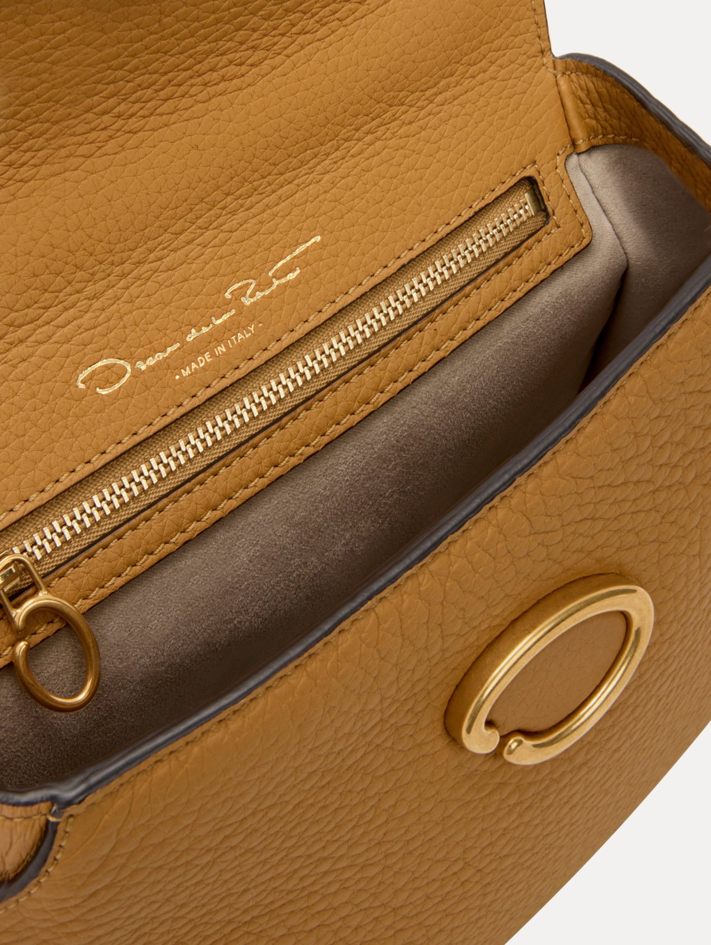 The Mini Poppy in Honey, Adorned with Oscar de la Renta's signature O at a discreet magnetic closure. Zoom View