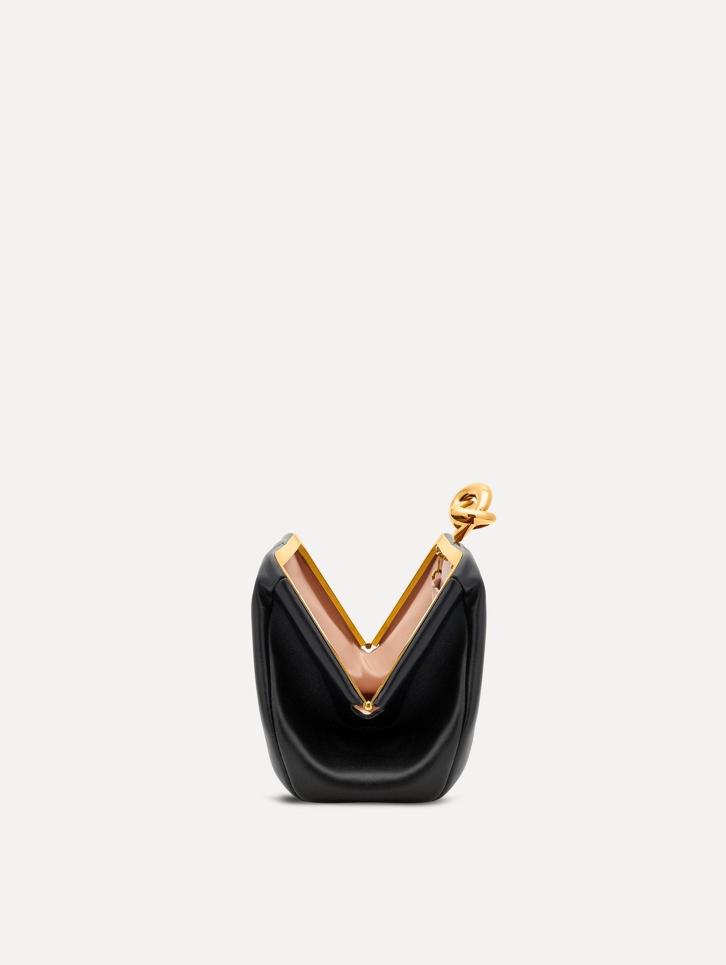 Open view of black clutch with gold 'O' emblem on the clasp.