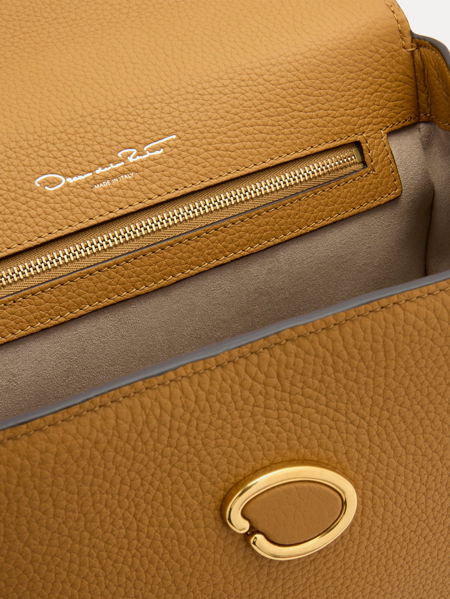 The Poppy in Honey, Adorned with Oscar de la Renta's signature O at a discreet magnetic closure. Zoom View