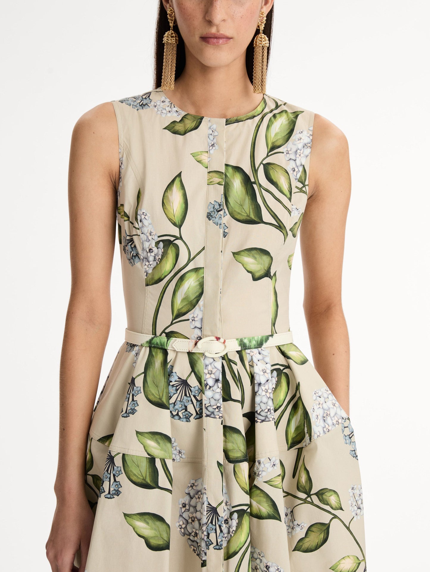 Porcelain Flower Cotton Poplin Dress This cotton poplin dress. Clean, sculpted lines. Relaxed, mid-length silhouette. with cinching matching self-belt at the waist. Front View, Close Up.