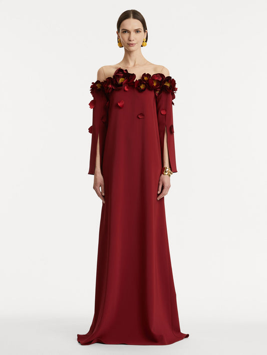 Full body front view of model wearing red split sleeve caftan with peony appliqués.