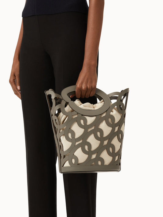 Oscar chain link bucket tote in grey with a large o forming the top handle and detachable shoulder strap. Front View.