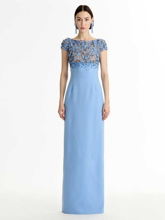 Blue floor length gown with Porcelain-flower motif on cap-sleeve bodice covered in sequins and crystals forming a delicate, petal-like lattice. Double-faced stretch wool skirt. Front View.
