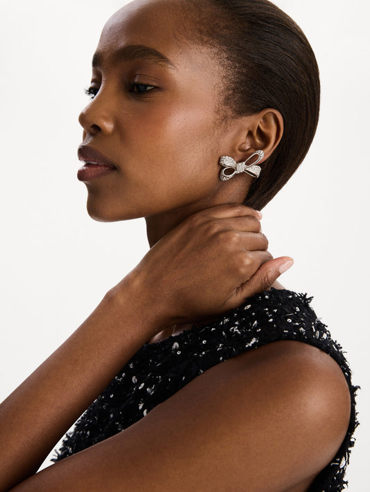 The Crystal Pavé Bow Earrings in Silver. Front view.