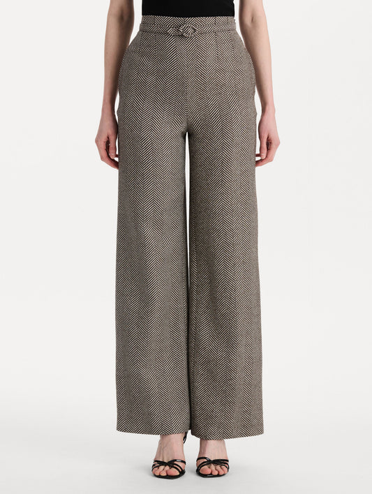 The model is wearing the Chevron Cashmere-Blend Pant featuring a high waist, pockets, and coordinating belt. Front View.