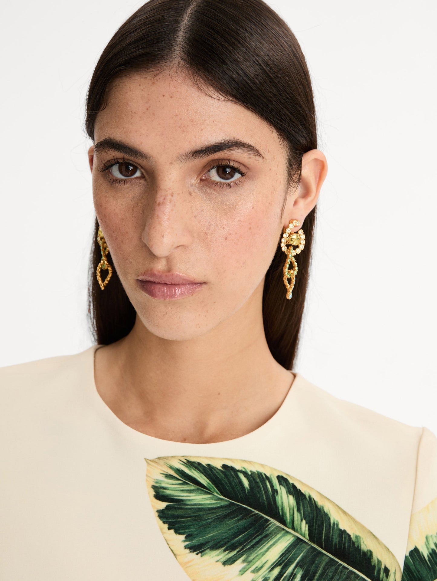 Gold Rhinestone Chain-Link Clip-On Earrings with green and clear crystals. Front View.