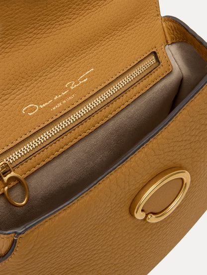 The Mini Poppy in Honey, Adorned with Oscar de la Renta's signature O at a discreet magnetic closure. Zoom View