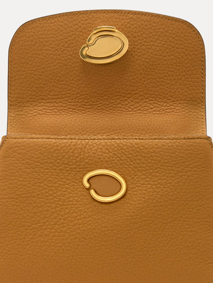 The Mini Poppy in Honey, Adorned with Oscar de la Renta's signature O at a discreet magnetic closure. Zoom View
