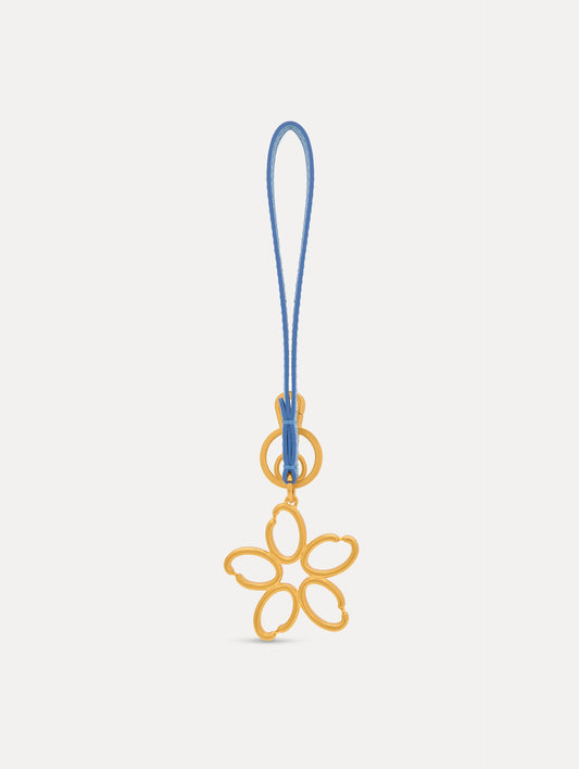 Gold O Flower Wristlet Key Chain with five open petals hangs from a blue leather loop strap, attached by a small gold ring and clasp. Front View.