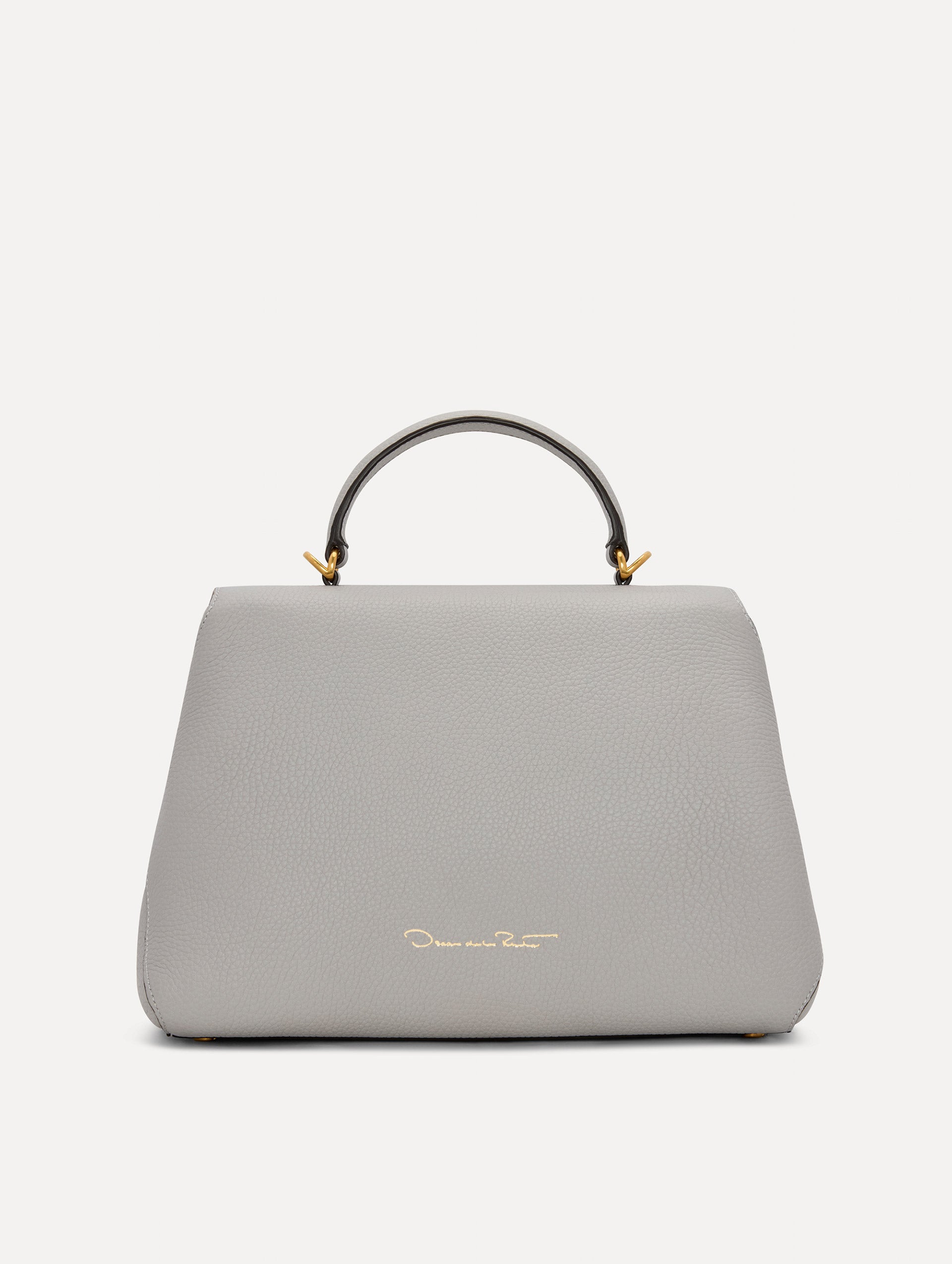 The Poppy Leather Handbag in Grey with O logo Tag around the Top Handle, and Detachable Shoulder Strap. Back View