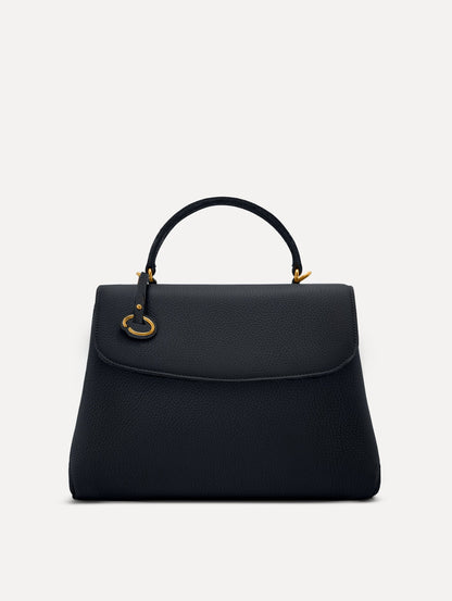 The Poppy leather bag in dark navy with O logo tag around the top handle. Front View