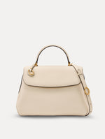 The Poppy Leather Handbag in Ivory with O tag around the Top handle and Detachable Shoulder Strap Front View