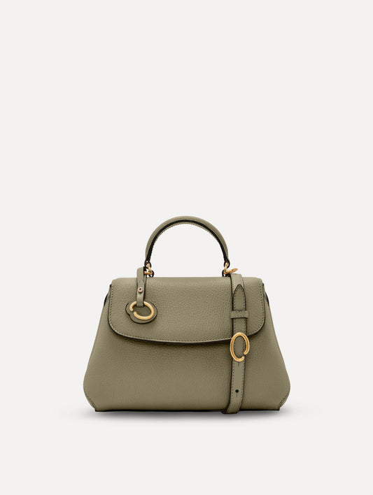 The Mini Poppy top handle bag in green. Front view.