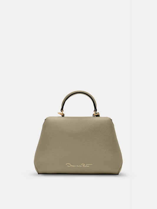 The Mini Poppy top handle bag in green. Back view.