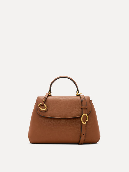 The Mini Poppy Leather Handbag in Brown with O tag around the Top handle and Detachable Shoulder Strap Front View