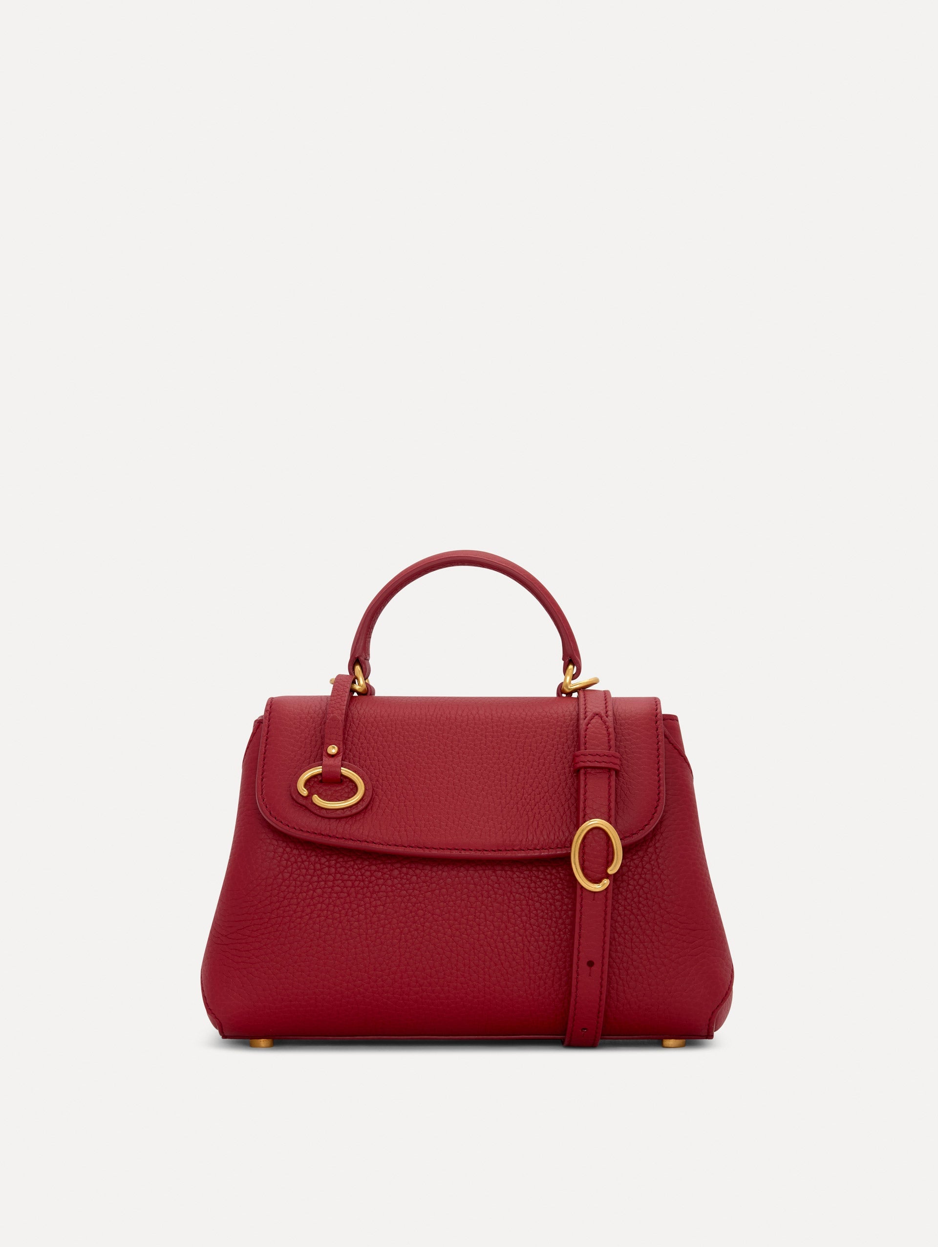The Mini Poppy Leather Handbag in Red with O tag around the Top handle and Detachable Shoulder Strap Front View
