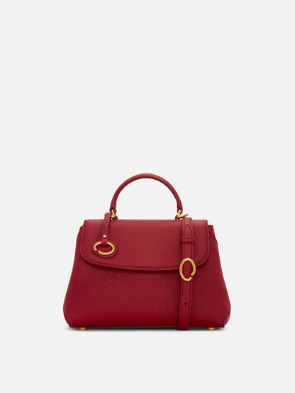 The Mini Poppy Leather Handbag in Red with O tag around the Top handle and Detachable Shoulder Strap Front View