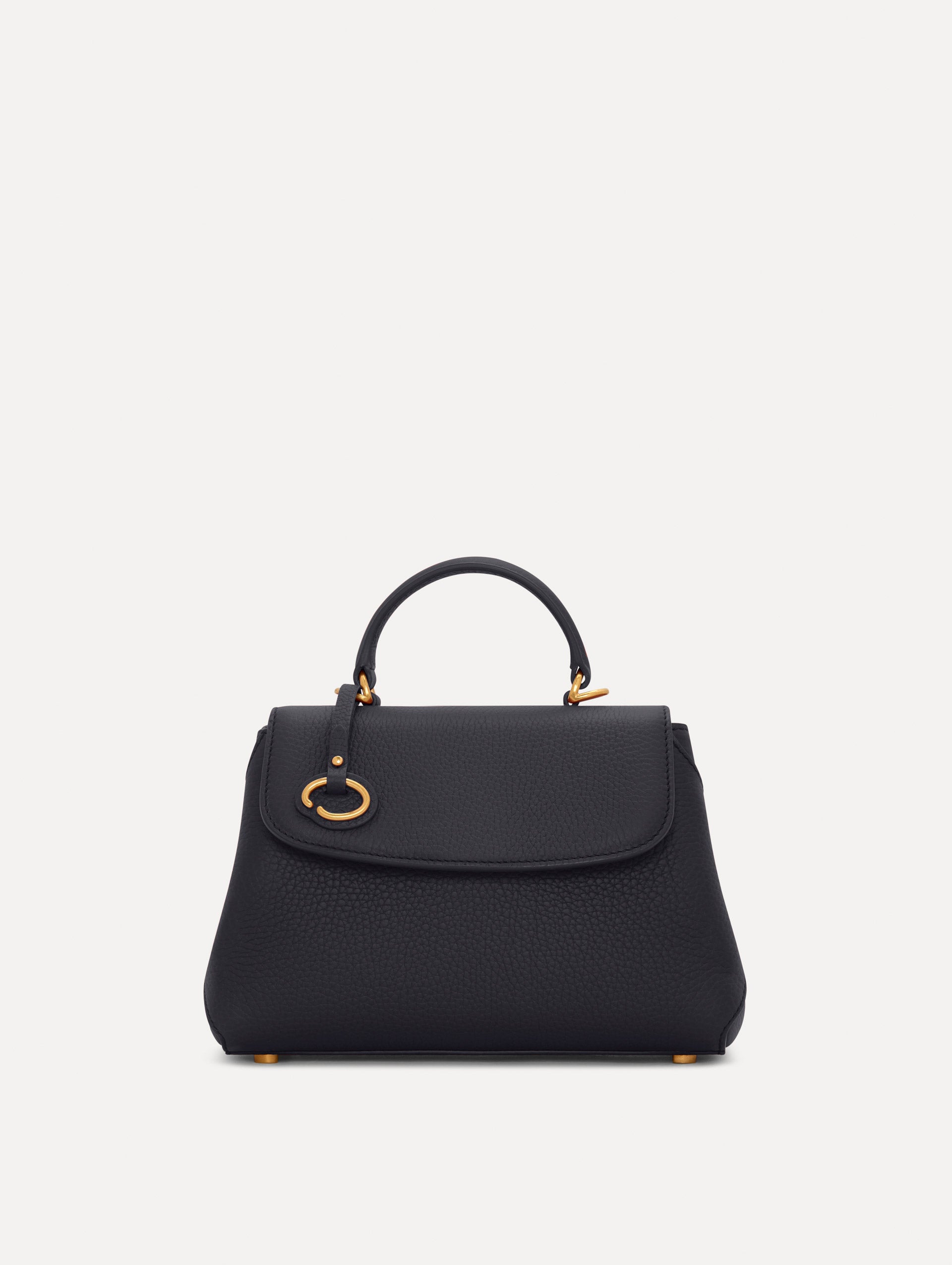 Mini Poppy in a light dark navy. The Mini Poppy is a top handle bag with a detachable shoulder strap, and it has the Oscar O logo attached around the top handle. Front View.