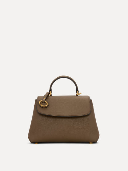 The Mini Poppy Leather Handbag in Stone with O tag around the Top handle Front View