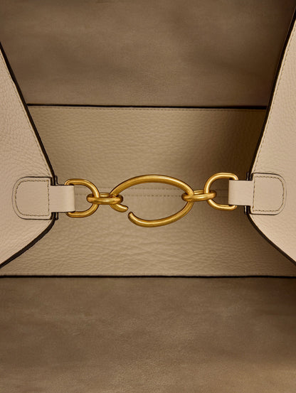 The Laser-Cut Orchid Topaz Tote in Ivory with O Clasp Inside Zoom View