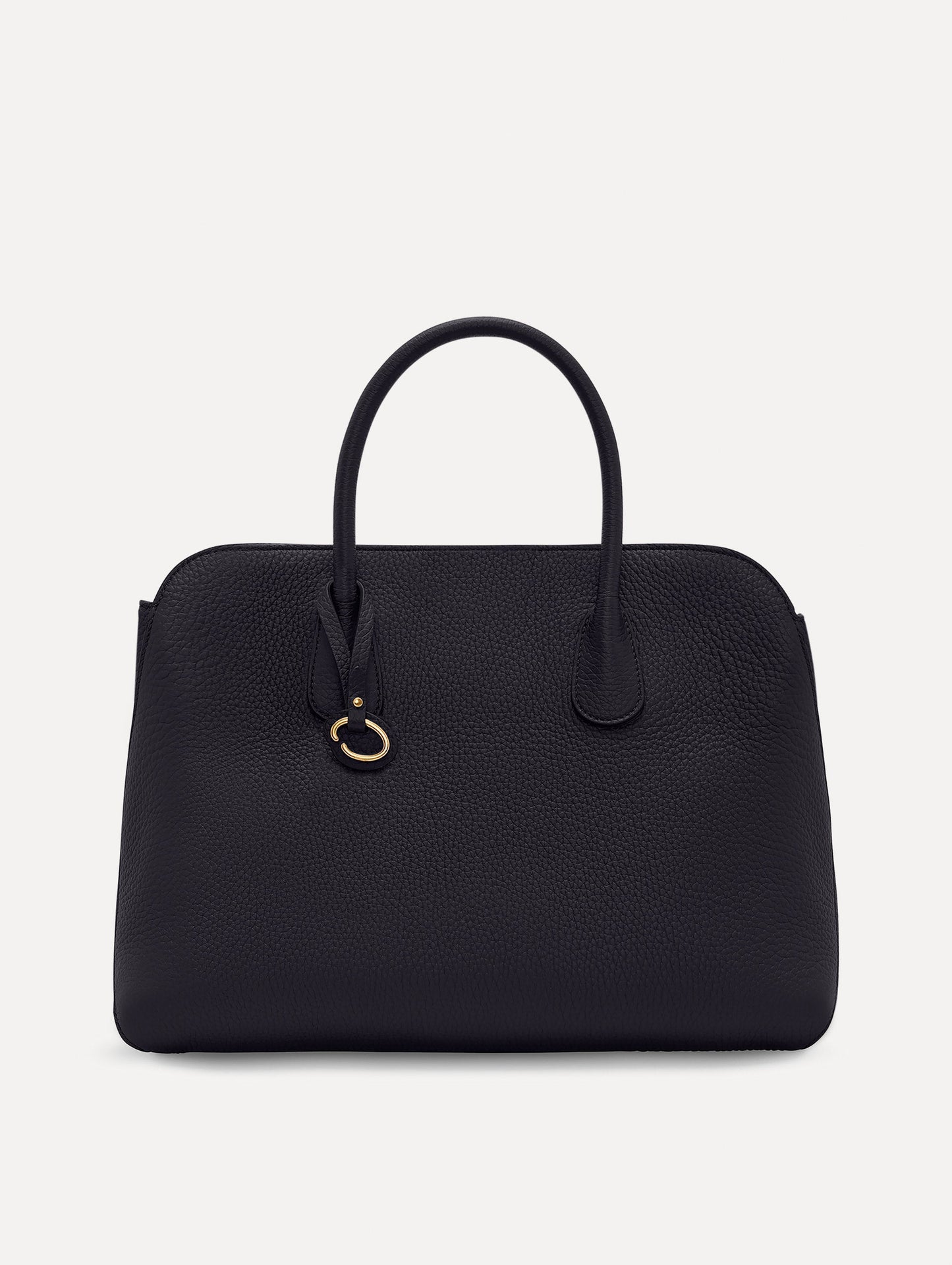 The Ivy top handle handbag in black, paired with some khaki pants. The bag comes with the Oscar O logo as a tag around the handle. Front View.