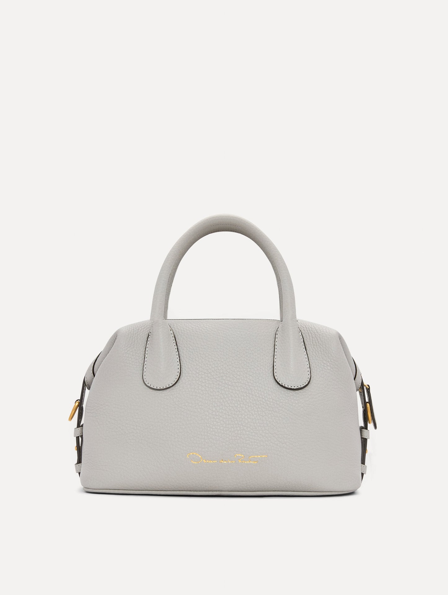 The Mini Dahlia Leather Handbag in Pearl Grey with Detachable Shoulder Strap and O logo tag around the Top Handle. Back View