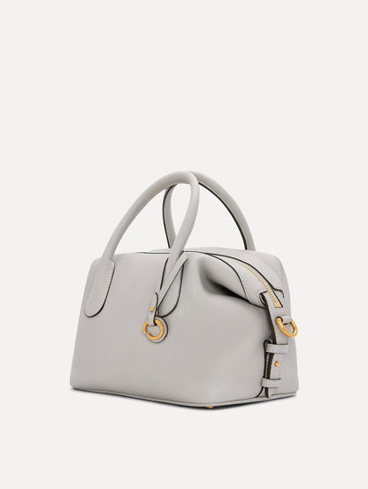 The Mini Dahlia Leather Handbag in Pearl Grey with Detachable Shoulder Strap and O logo tag around the Top Handle. Side View