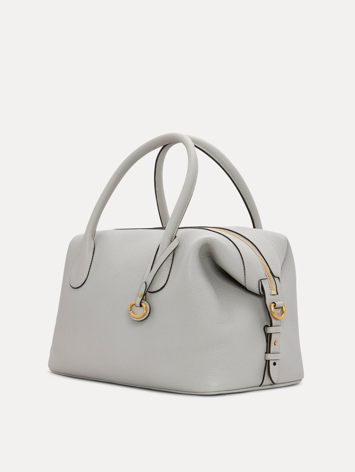 The Dahlia Leather Handbag in Pearl Grey with detachable Shoulder Strap and O logo tag Around the top handle. Side View
