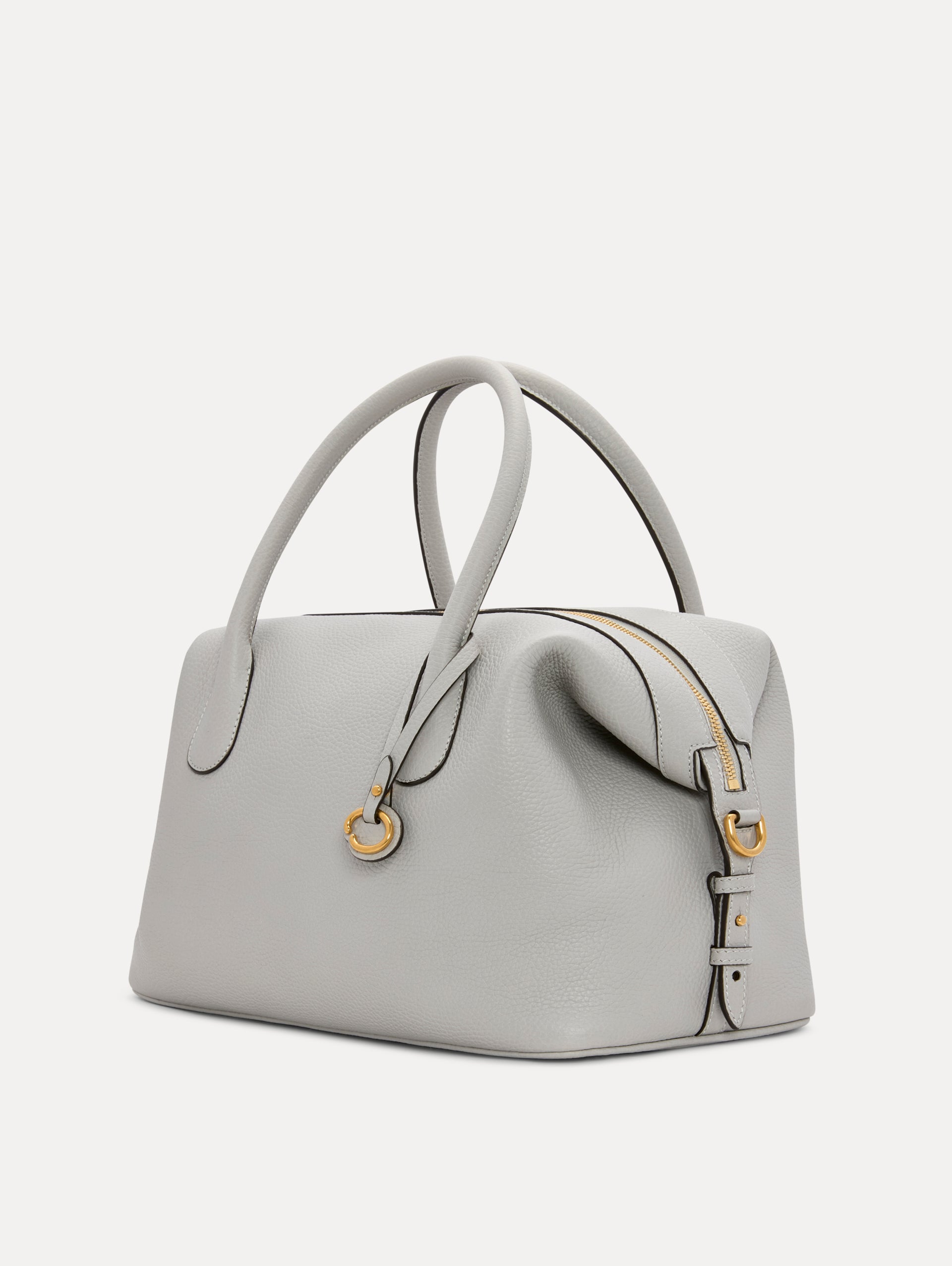 The Dahlia Leather Handbag in Pearl Grey with detachable Shoulder Strap and O logo tag Around the top handle. Side View