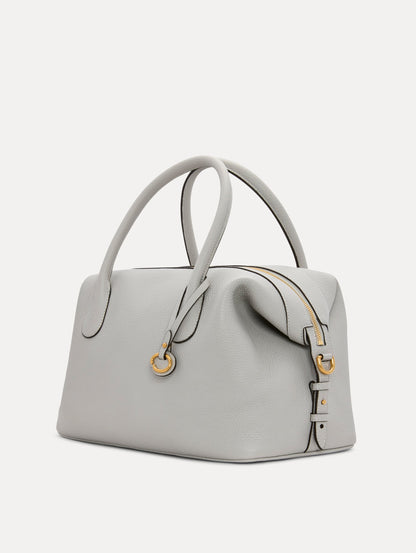 The Dahlia Leather Handbag in Pearl Grey with detachable Shoulder Strap and O logo tag Around the top handle. Side View