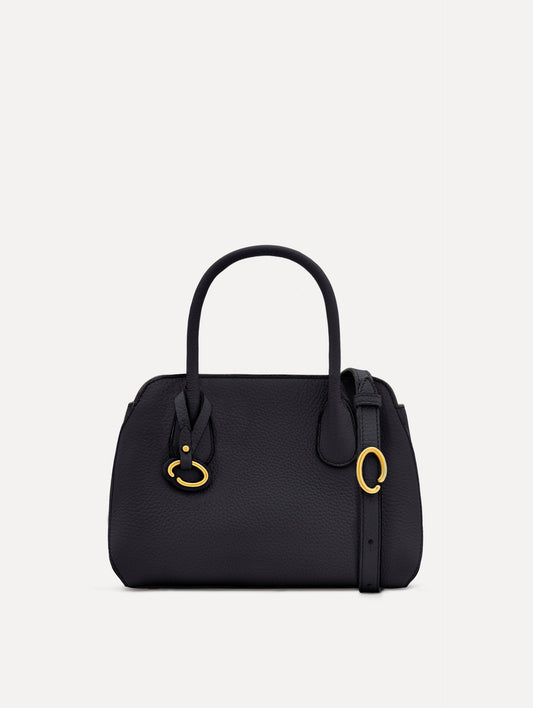 Mini Ivy in a light dark navy. The Mini Ivy is a top handle bag with a detachable shoulder strap, and it has the Oscar O logo attached around the top handle. Front View.