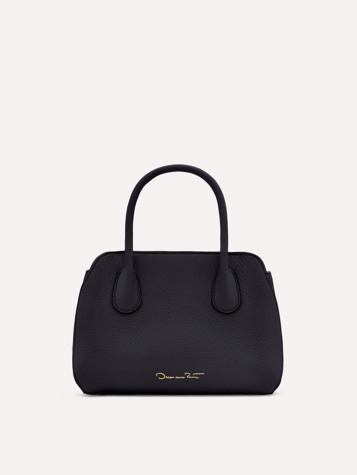 Mini Ivy in a light dark navy. The Mini Ivy is a top handle bag with a detachable shoulder strap, and it has the Oscar O logo attached around the top handle. Back View.