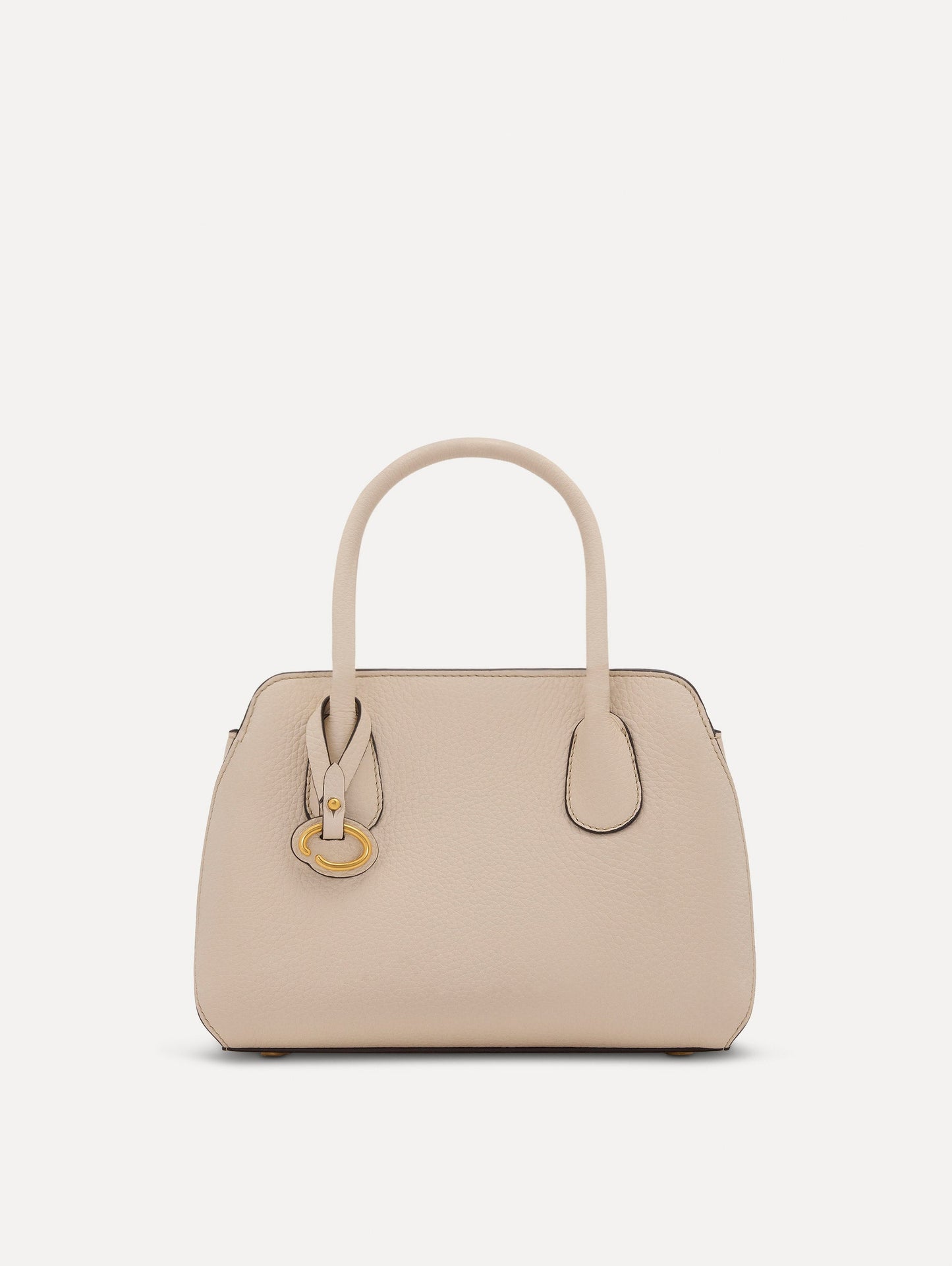 The Mini Ivy top handle handbag in Ivory. This bag comes with a detachable shoulder strap and has an Oscar O logo tag around the handle. Front View.