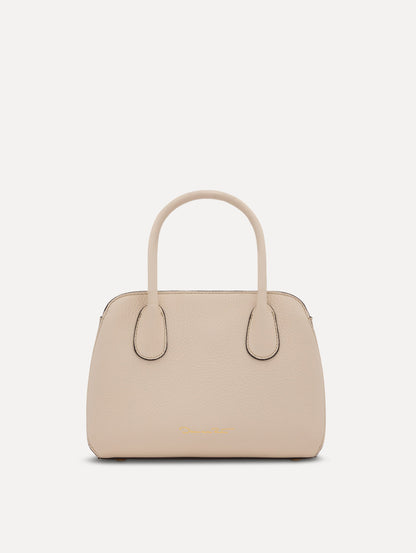 The Mini Ivy top handle handbag in Ivory. This bag comes with a detachable shoulder strap and has an Oscar O logo tag around the handle. Back View.