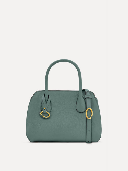 Mini Ivy in a light mint color. The Mini Ivy is a top handle bag with a detachable shoulder strap, and it has the Oscar O logo attached around the top handle. Front View.