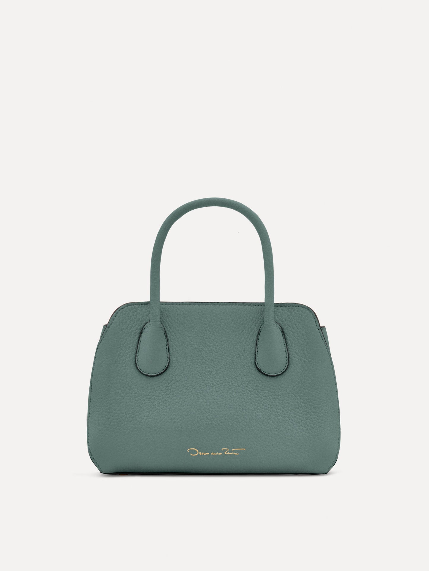 Mini Ivy in a light mint color. The Mini Ivy is a top handle bag with a detachable shoulder strap, and it has the Oscar O logo attached around the top handle. Back View.