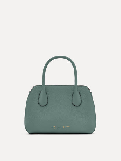 Mini Ivy in a light mint color. The Mini Ivy is a top handle bag with a detachable shoulder strap, and it has the Oscar O logo attached around the top handle. Back View.