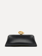 Black clutch with gold 'O' emblem on the clasp.