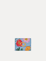 Blue Poppy Printed Tri-Fold Wallet featuring a gold O motif clasp and pink, red, and orange floral poppy motifs. Front View.