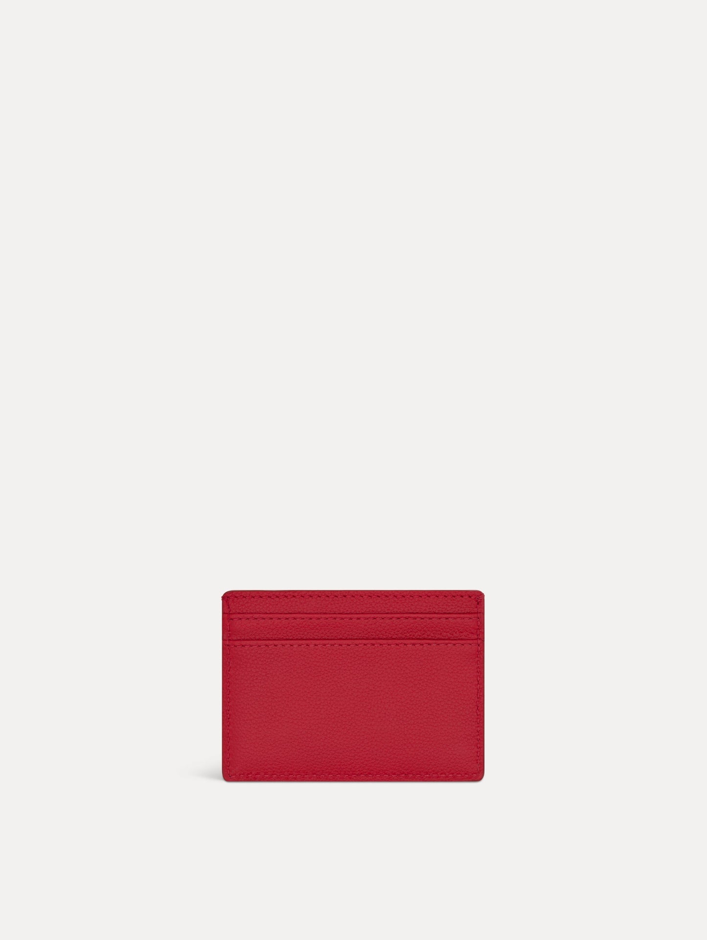 Red card case featuring gold printed Oscar de la Renta logo on back. Front View.