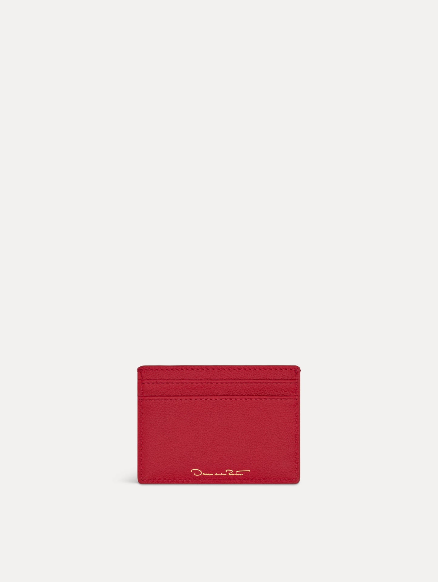 Red card case featuring gold printed Oscar de la Renta logo on back. Back View.