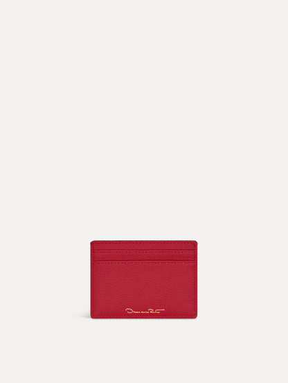 Red card case featuring gold printed Oscar de la Renta logo on back. Back View.