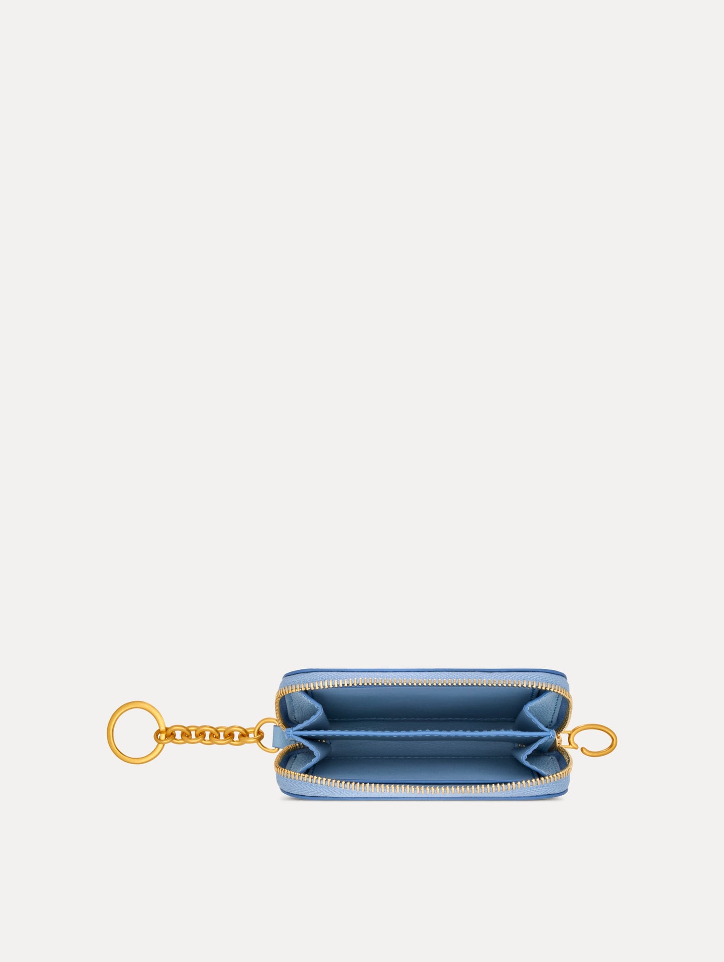 Blue Poppy Printed Zip Card case with white and red floral motifs and gold hardware. Top View.