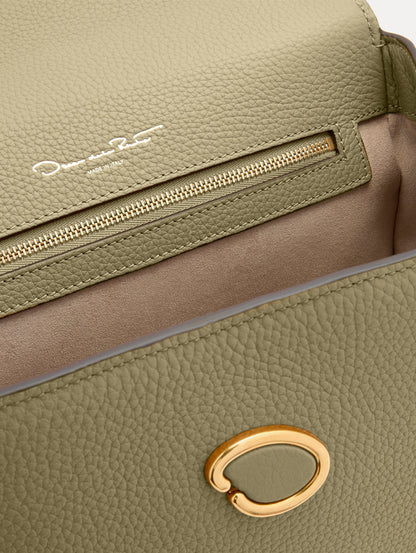 The Poppy in Sage Green, Adorned with Oscar de la Renta's signature O at a discreet magnetic closure. Zoom View