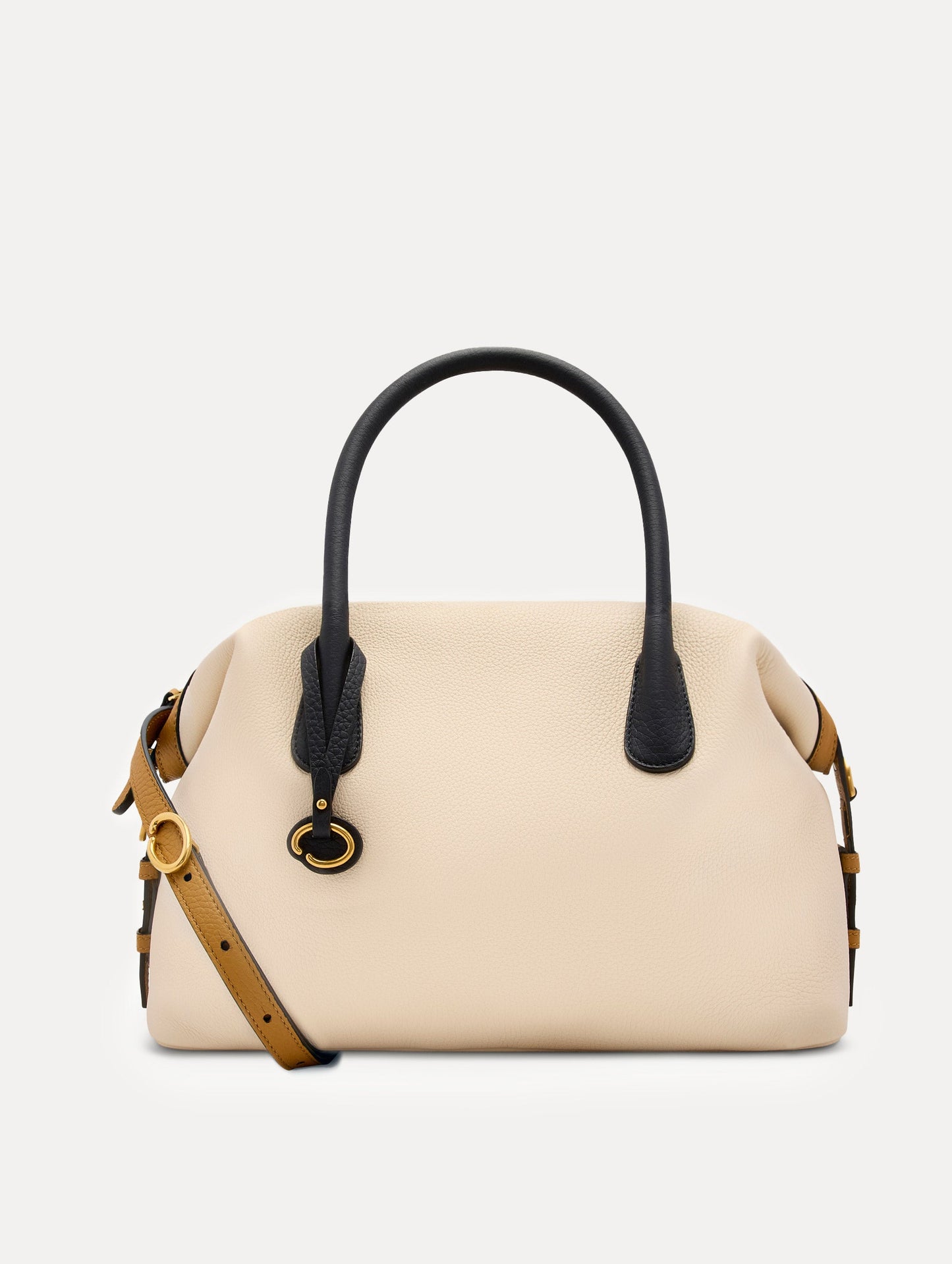 The Dahlia Handbag in Ivory with Black Top Handle and Honey sides. Adorned with Oscar de la Renta's signature logo in the bottom center of the back of the bag. Front View.