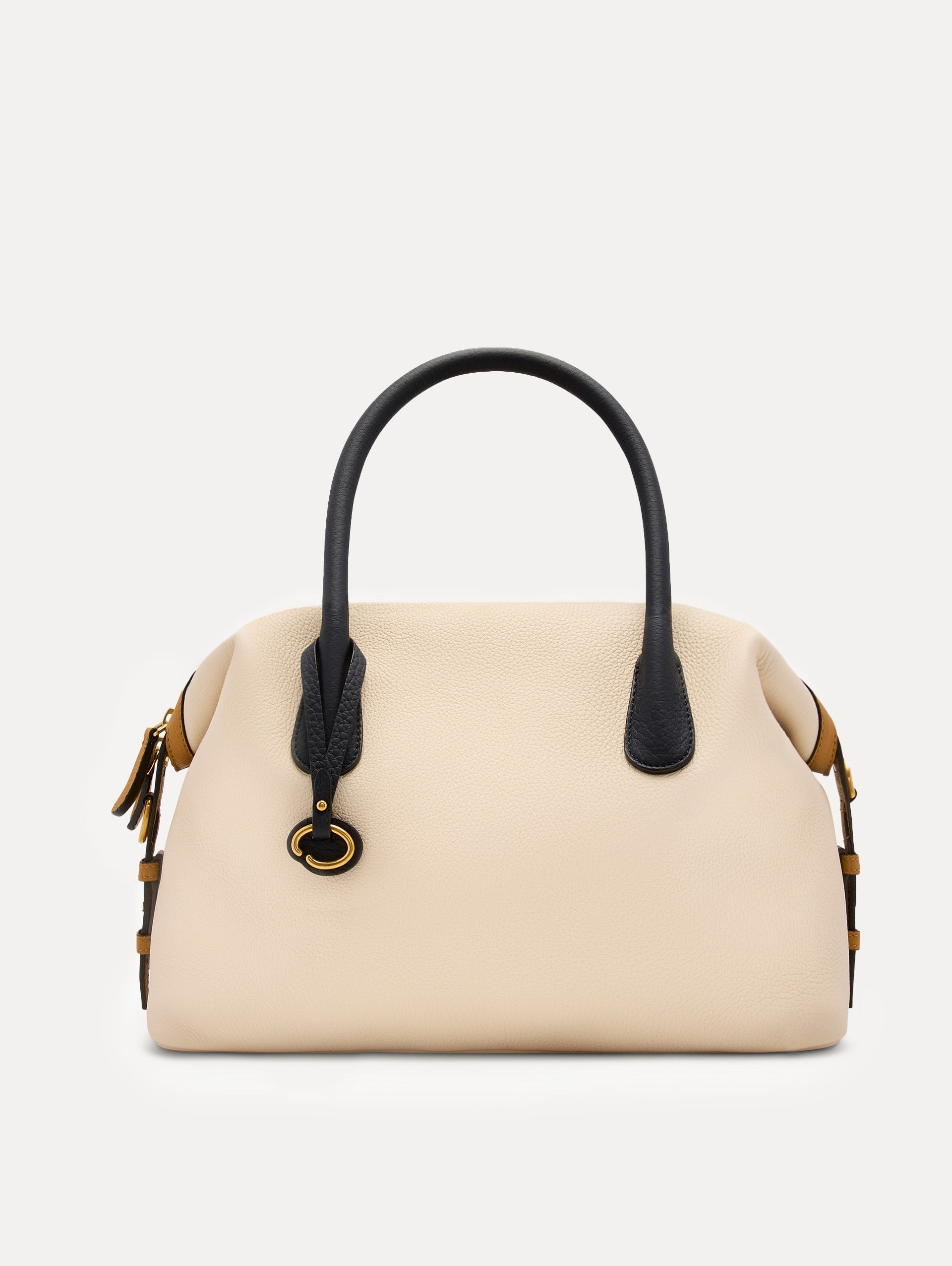 The Dahlia Handbag in Ivory with Black Top Handle and Honey sides. Adorned with Oscar de la Renta's signature logo in the bottom center of the back of the bag. Front View.