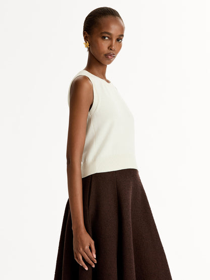 Sleeveless, halter neck, classic knit tank in soft ivory. Side View.