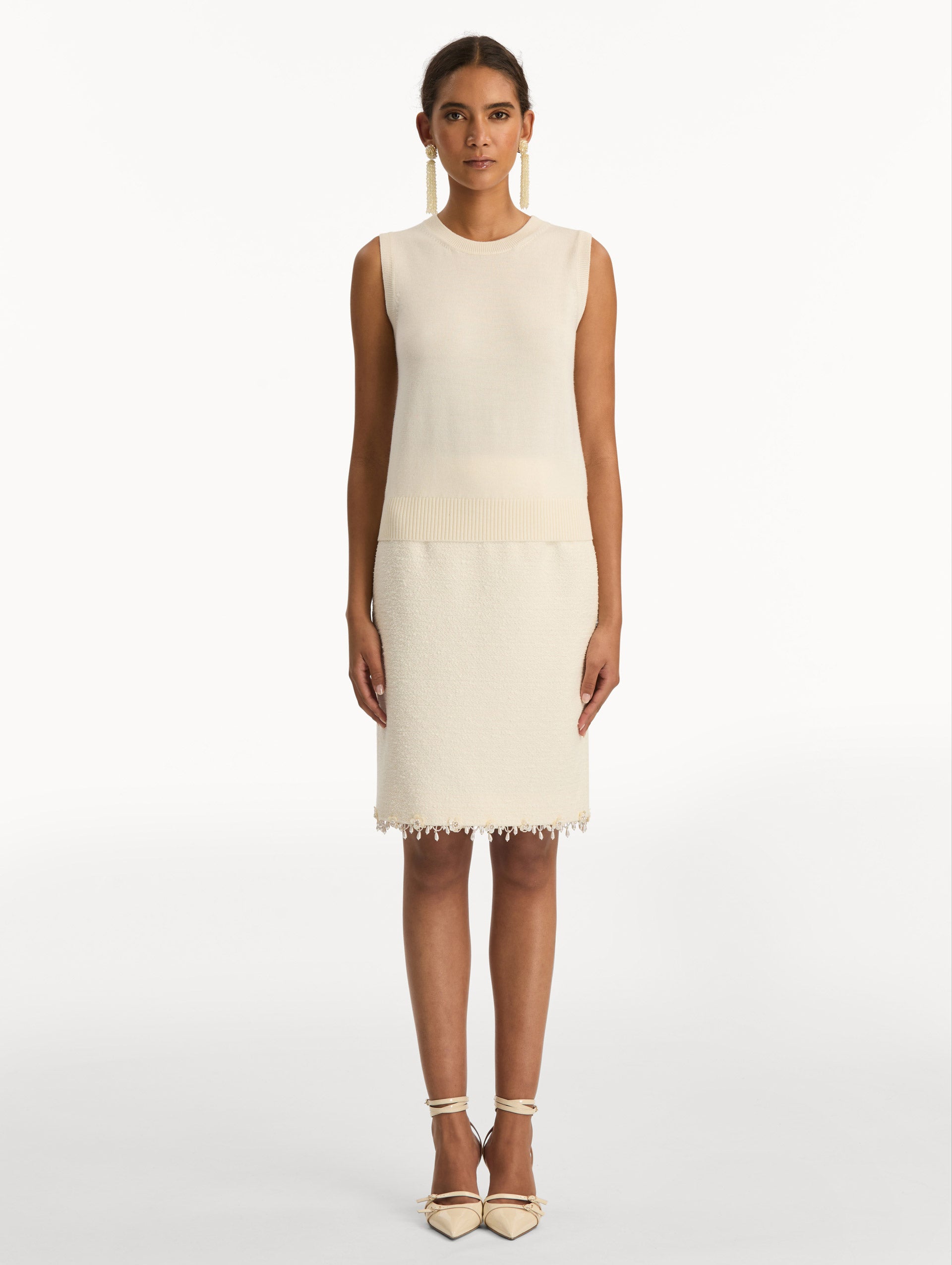 Ivory Virgin Wool Tank featuring a crew neckline and ribbed hem. Front View.