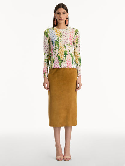White Foxglove Printed Cardigan featuring multicolor foxglove motifs in yellow, pink, and green. Front View.