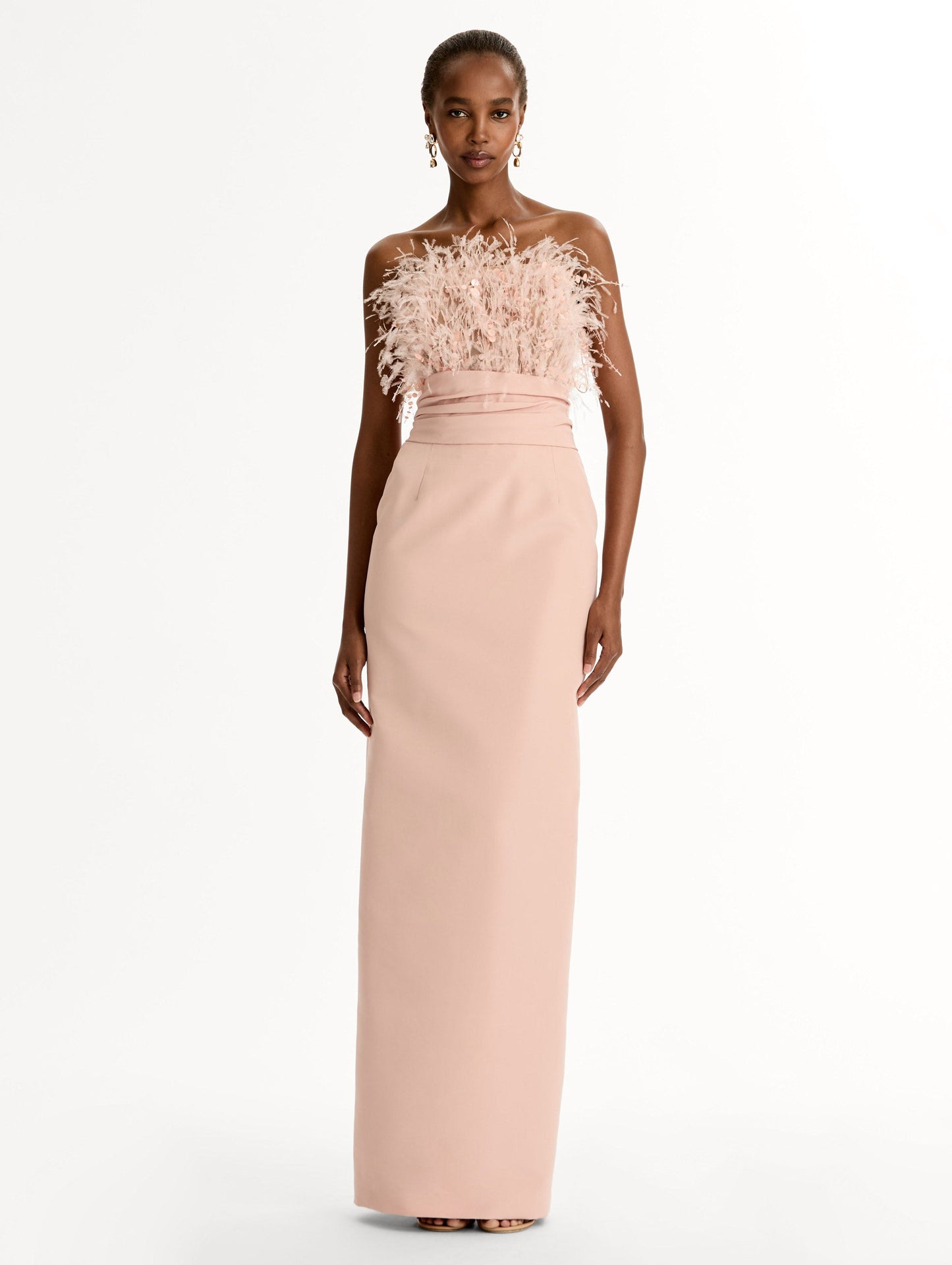 Pink floor length gown with strapless bodice adorned with Point d’Esprit feather embroidery. Sleek faille skirt. Front View.